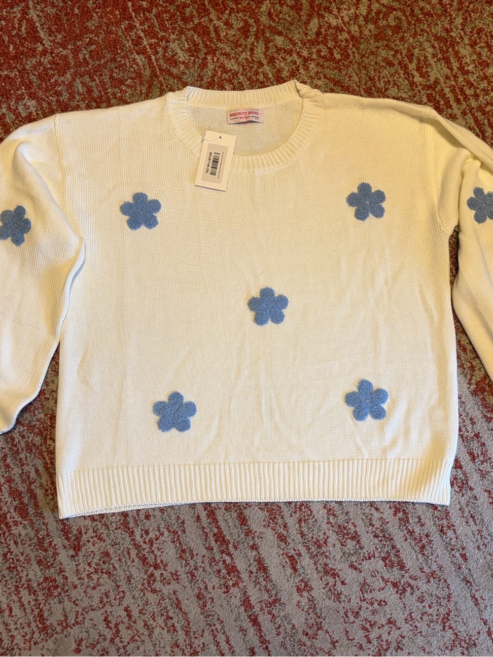 Cream Crewneck Sweater with Blue Floral Appliqués